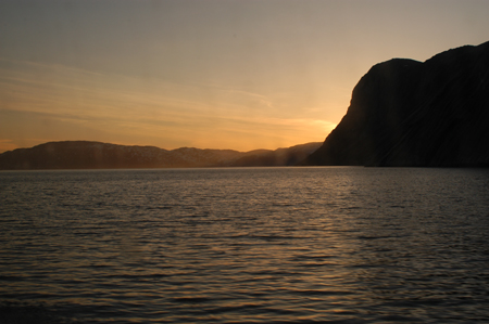 c-Solnedgang over fjorden